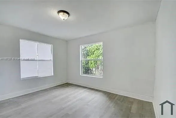 an empty room with windows