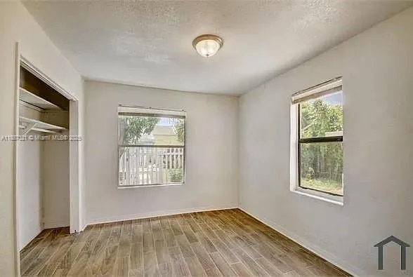 a view of livingroom with hardwood floor and a ceiling fan
