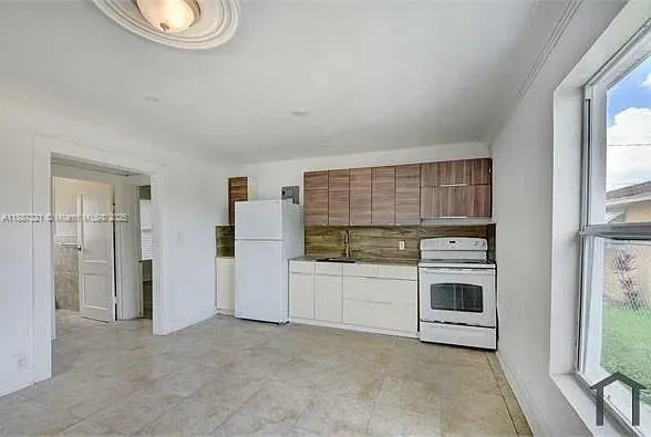 a kitchen with stainless steel appliances a stove and a refrigerator