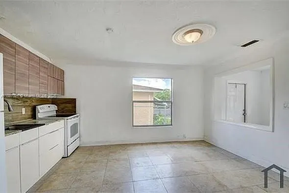 a bathroom with a sink a toilet and a bathtub
