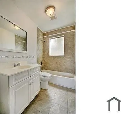 a bathroom with a sink mirror toilet and bathtub