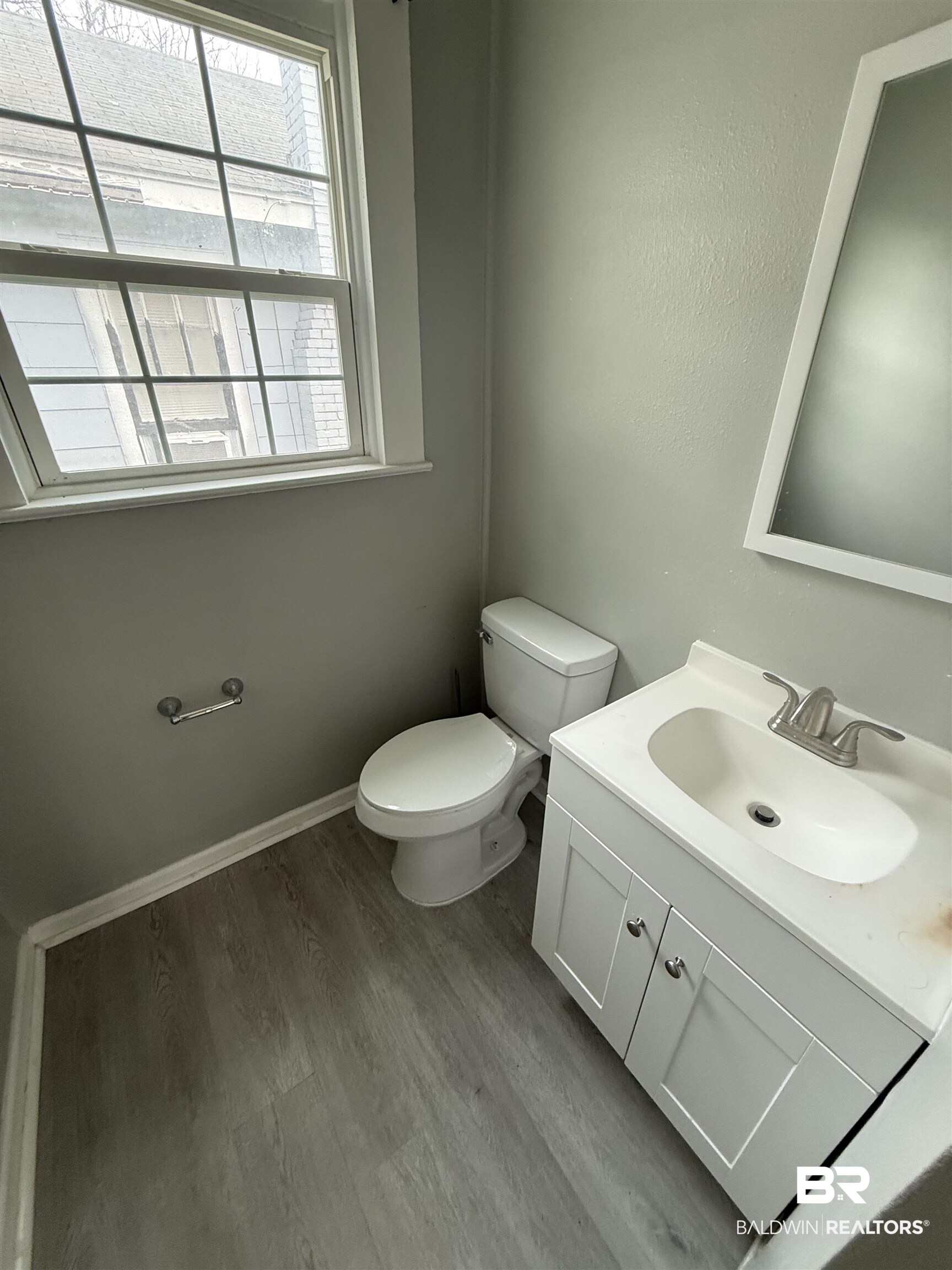 1848 Canal Street Mobile, AL 36606 - Photo 5 of 11 Bathroom with vanity and dark wood-style floors