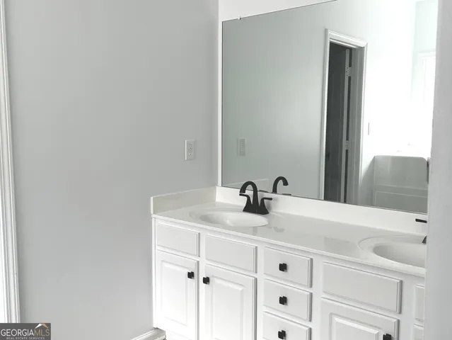 a close view of a sink and a mirror