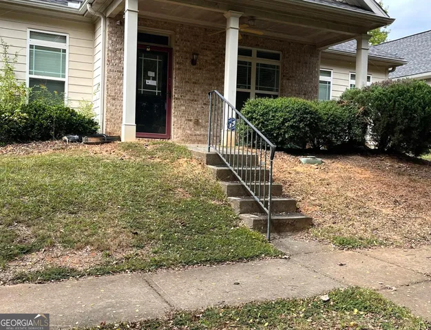 a house with a tree in front of the house