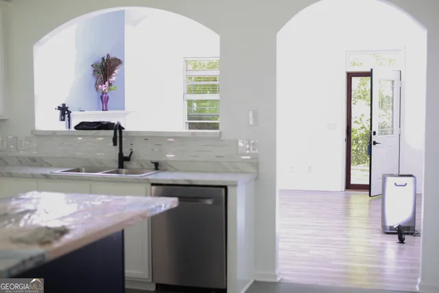 a kitchen with a sink and cabinets