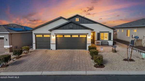a front view of house with yard outdoor seating and barbeque oven