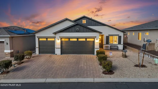 a front view of house with yard outdoor seating and barbeque oven