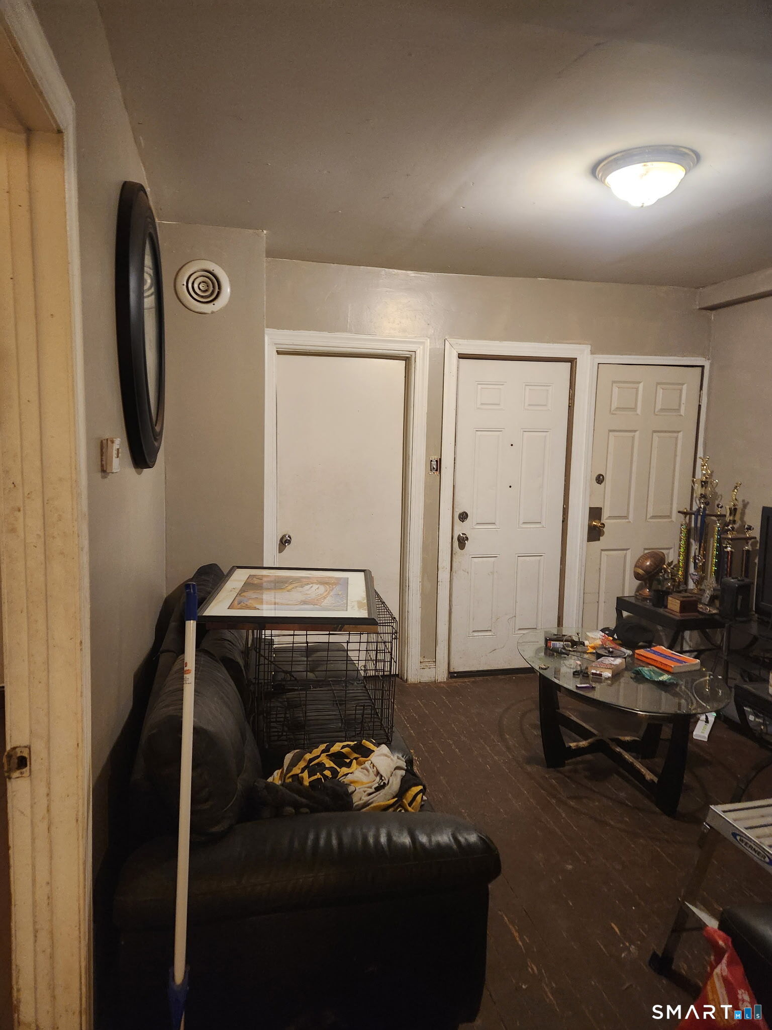 38 Church Street Enfield, CT 06082 - Photo 2 of 13 a living room with furniture and a flat screen tv
