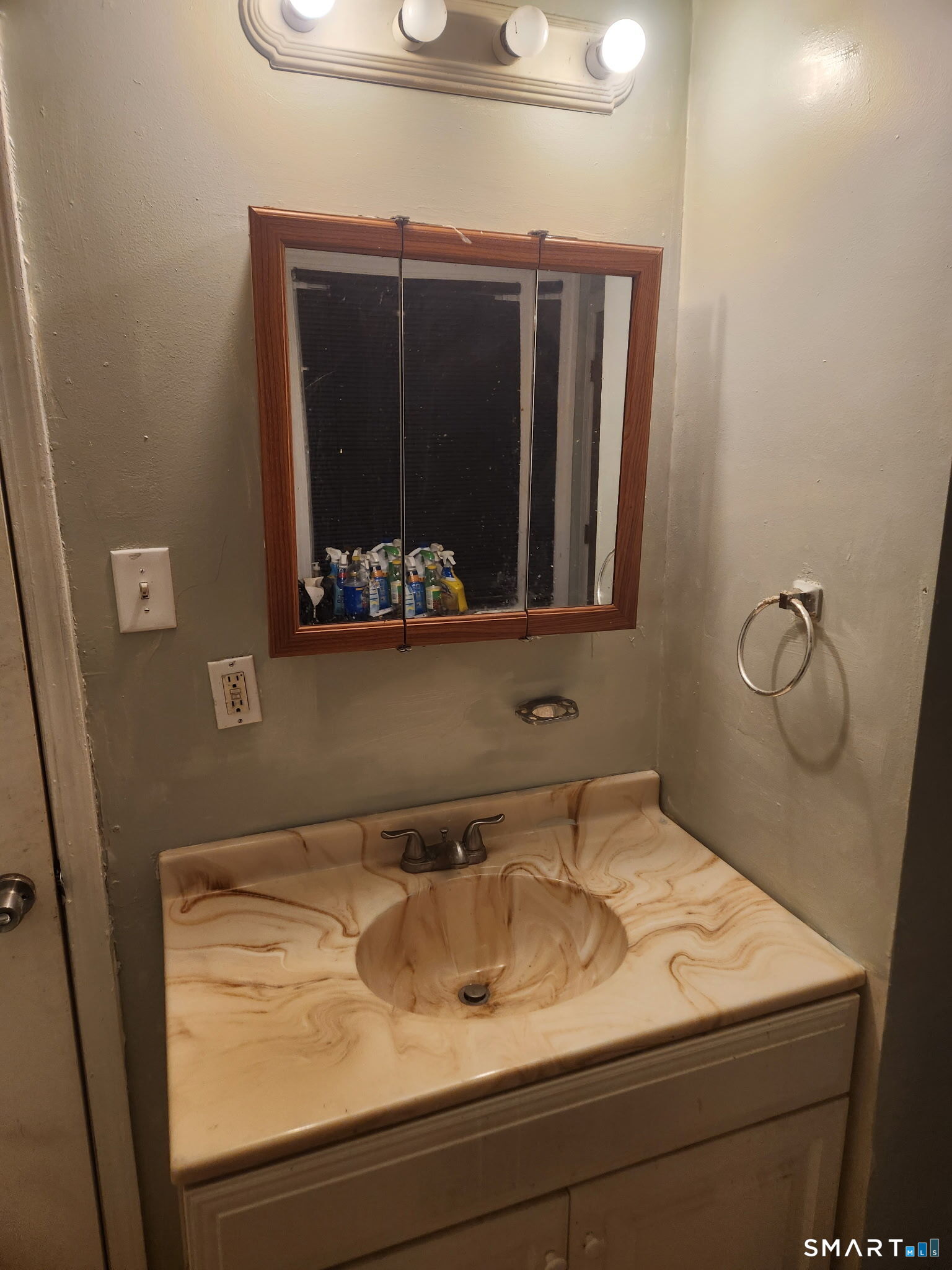 38 Church Street Enfield, CT 06082 - Photo 5 of 13 a bathroom with a sink and mirror
