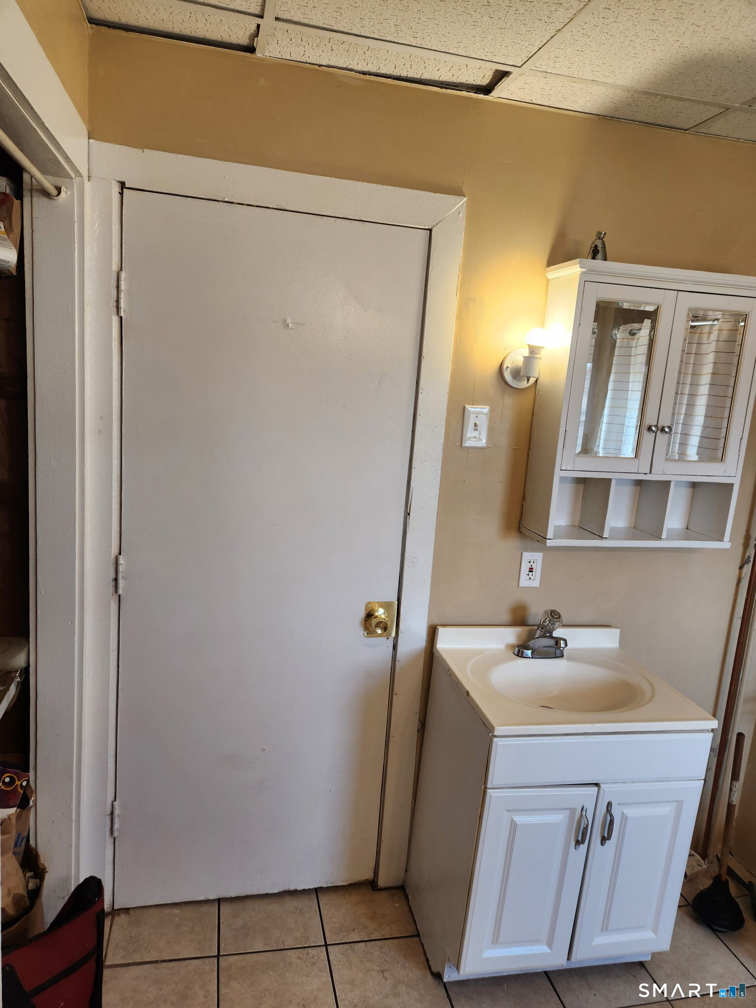 38 Church Street Enfield, CT 06082 - Photo 8 of 13 a bathroom with a sink a mirror and a vanity