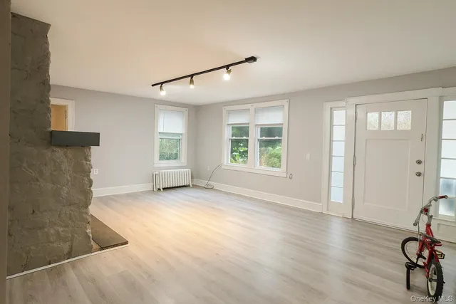 a view of livingroom with hardwood floor and window