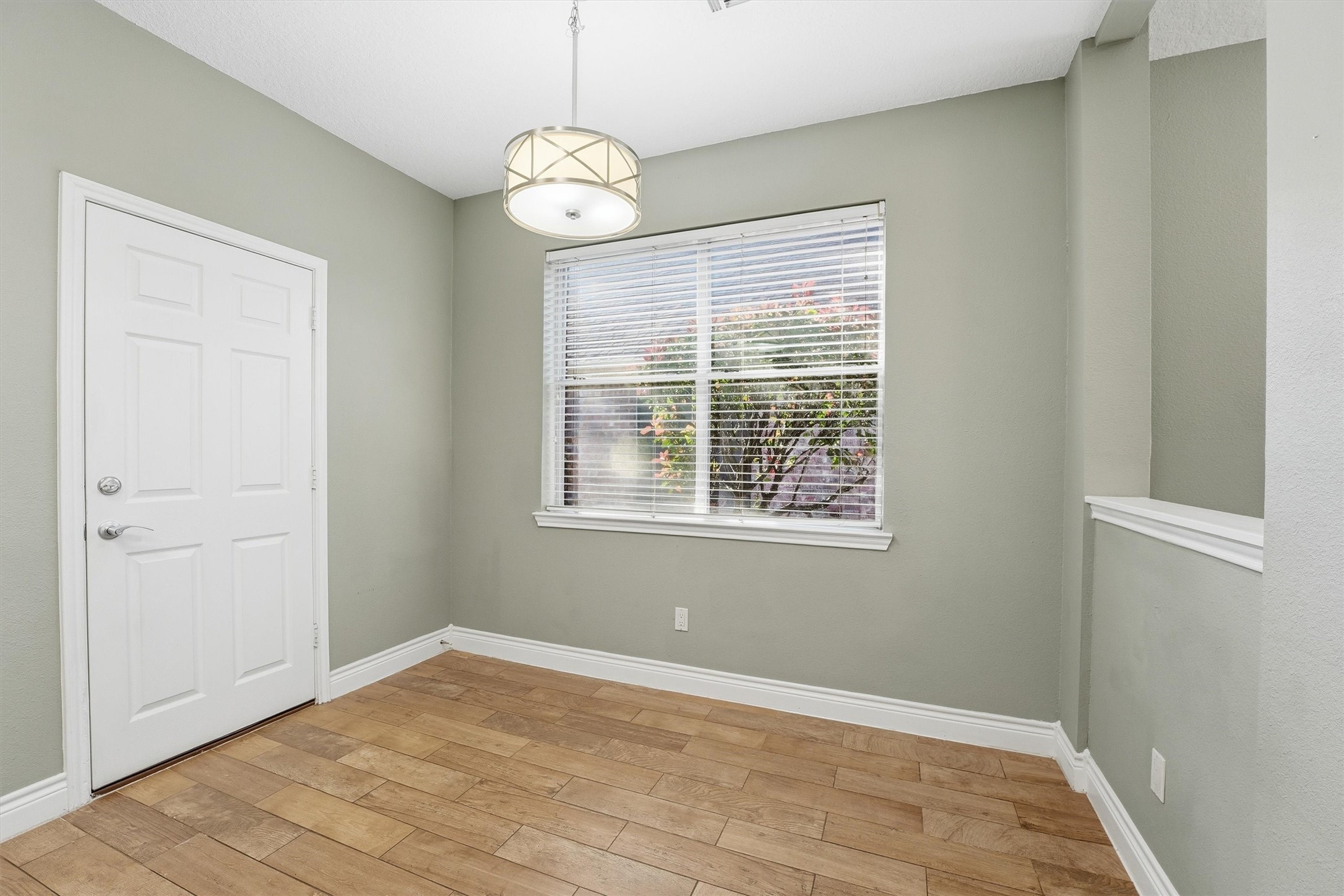 5719 Walkabout Way Katy, TX 77450 - Photo 12 of 25 Tucked just off the kitchen, the breakfast nook feels like its own little sunroom. With a large window, it's bright, cheerful, and perfect for starting your day. It’s a space that invites you to linger just a little longer.