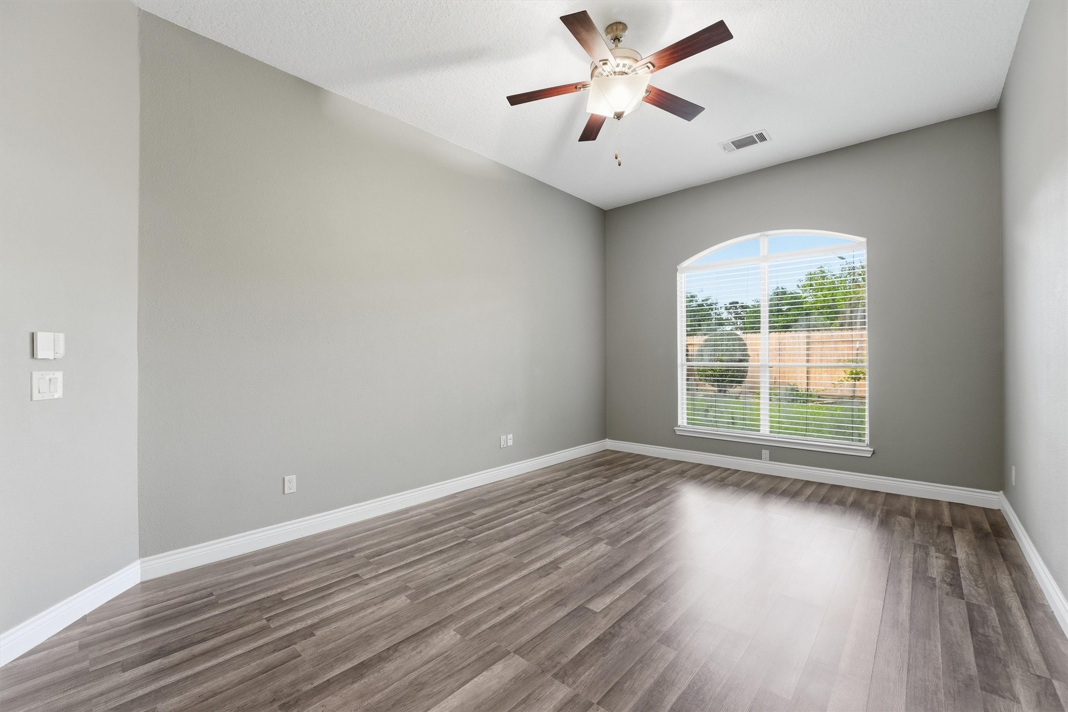 5719 Walkabout Way Katy, TX 77450 - Photo 13 of 25 The primary suite is a true retreat, filled with natural light and designed for relaxation. The space feels calm, private, and perfectly sized to unwind at the end of the day.