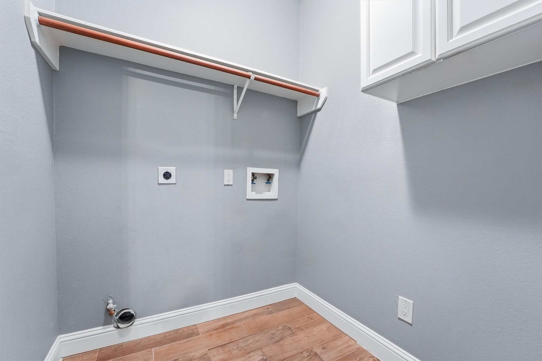5719 Walkabout Way Katy, TX 77450 - Photo 21 of 25 Convenience meets functionality in the in-home utility room. With built-in shelving and cabinetry, there’s room to stay organized and keep essentials tucked away. It’s thoughtfully placed to make everyday tasks feel easier. Practical never looked so clean and efficient.