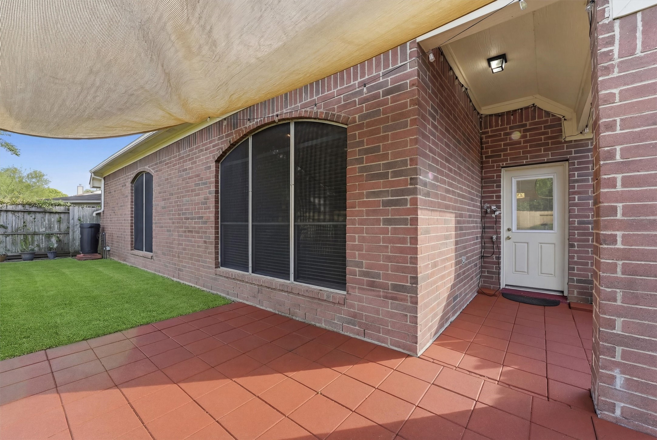 5719 Walkabout Way Katy, TX 77450 - Photo 22 of 25 Step outside to a covered patio that’s ready for weekend BBQs or quiet evenings.
