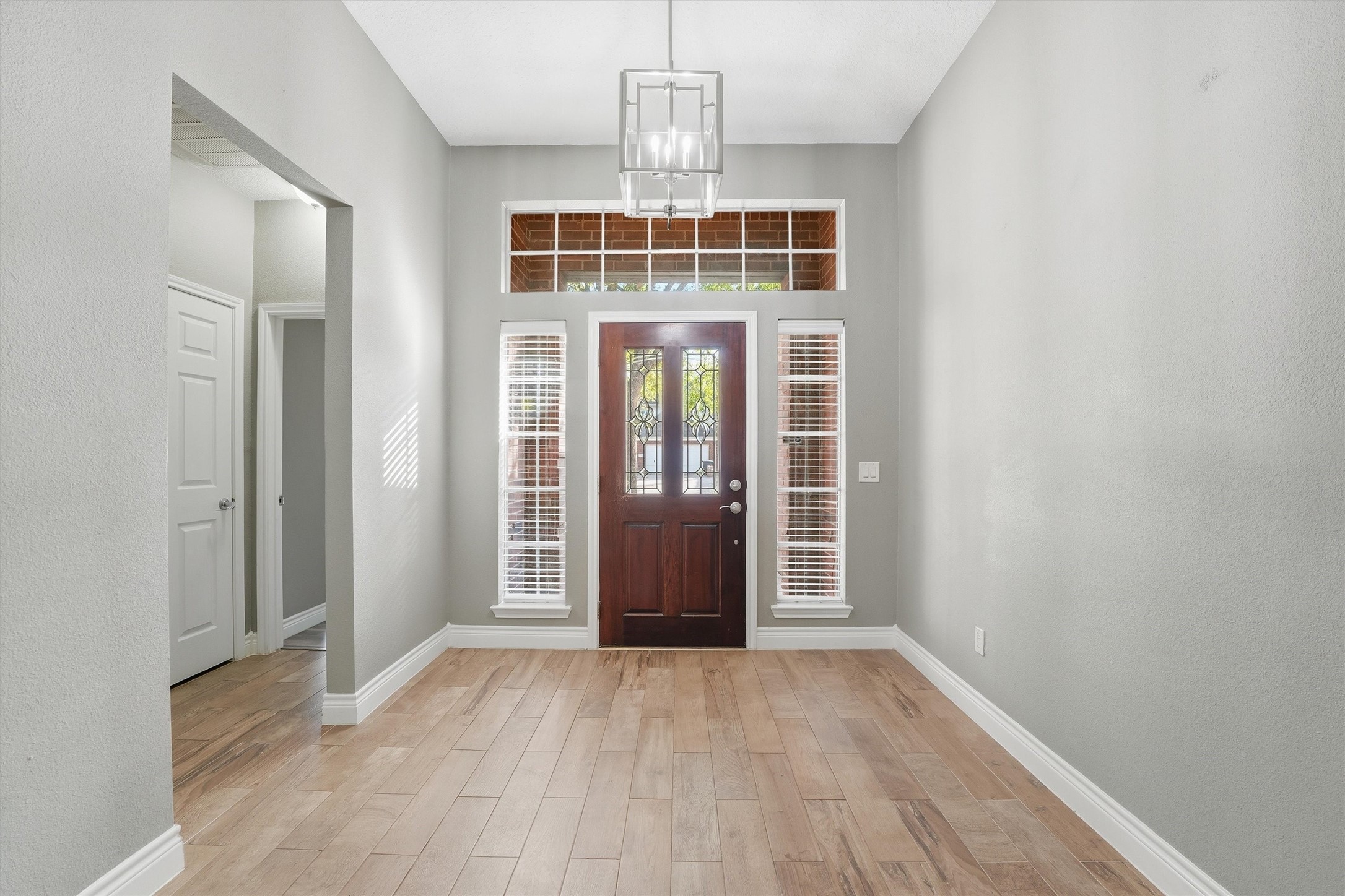 5719 Walkabout Way Katy, TX 77450 - Photo 4 of 25 Natural light pours in, giving the space an open, airy introduction. It’s an entry that feels both polished and comfortable from the very first step.