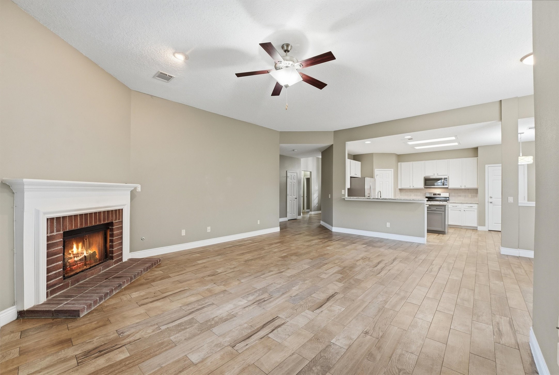 5719 Walkabout Way Katy, TX 77450 - Photo 8 of 25 Designed to keep you connected, the kitchen opens directly to the family room, making everyday living and entertaining effortless.