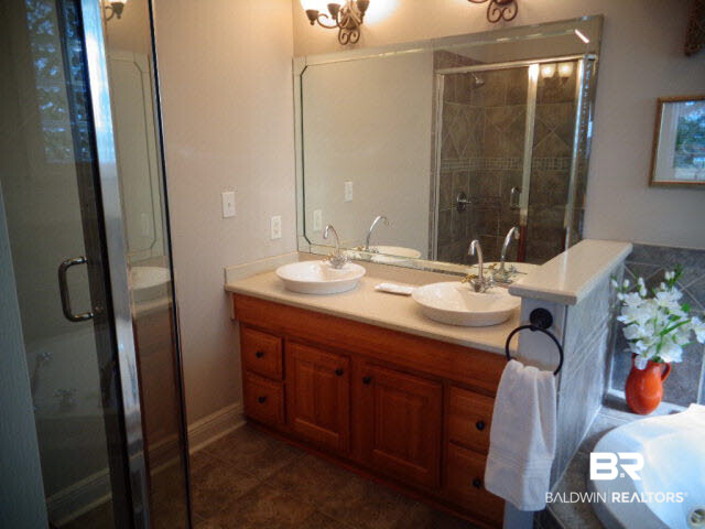 6674 Cook Road Foley, AL 36535 - Photo 22 of 45 Custom double vanity. Ceramic tiled floor. Crown molding.