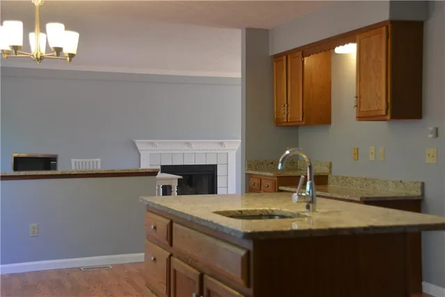 a kitchen with a sink and a microwave