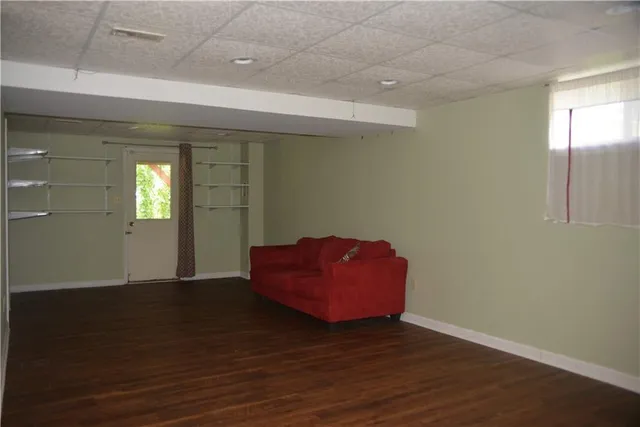 a view of balcony with wooden fence and trees