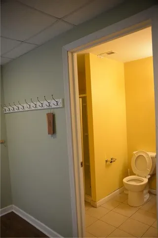 a view of backyard with wooden fence and trees