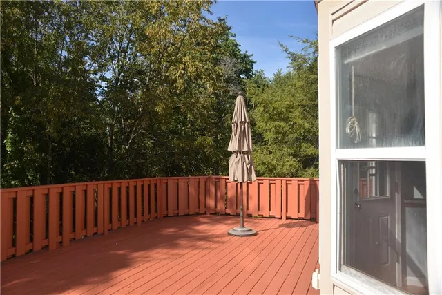 a view of a house with a yard and tree s