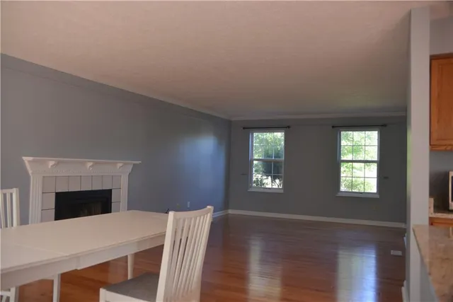 a room with a bed and a fireplace