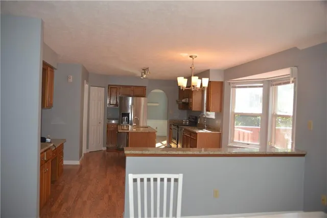 a view of a kitchen from the hallway