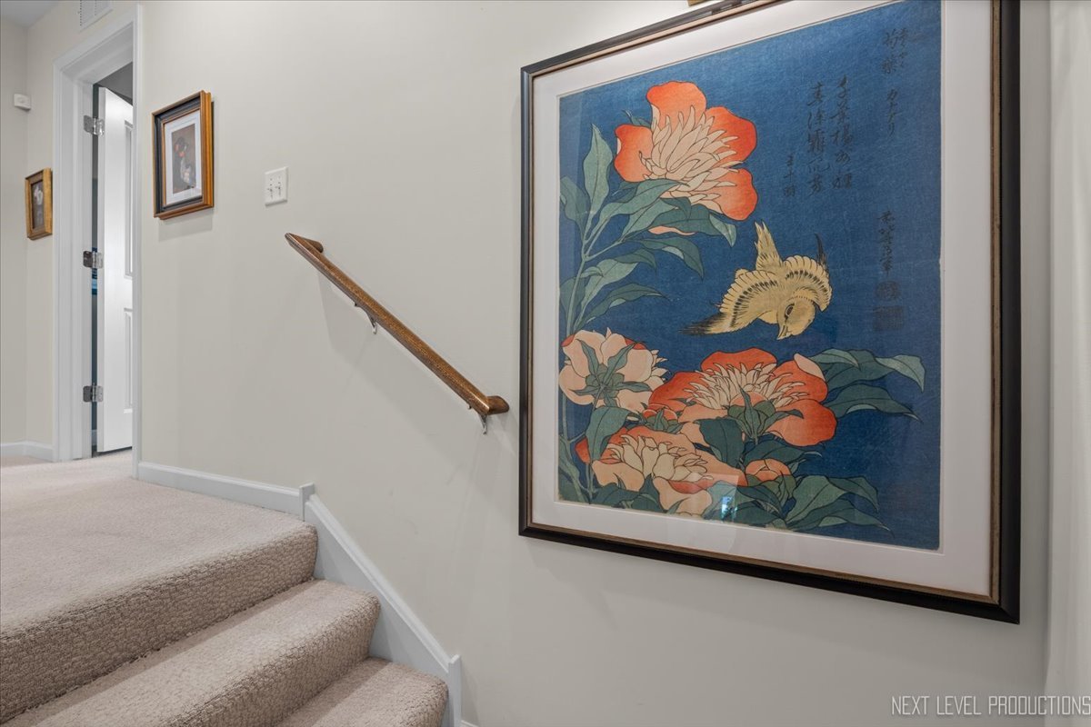 1255 Josiah Road Naperville, IL 60563 - Photo 17 of 39 a bedroom with a painting on the wall and a painting on the wall