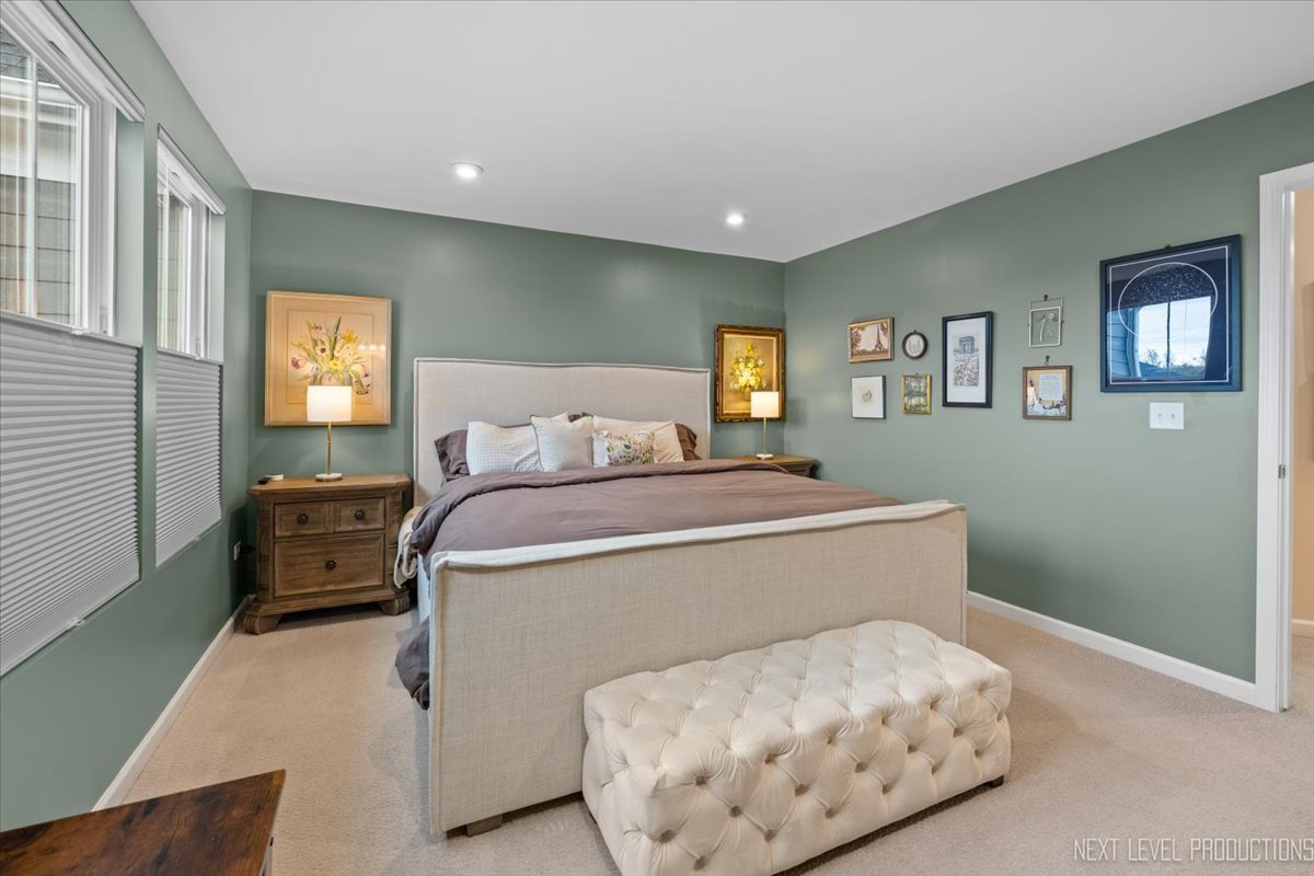 1255 Josiah Road Naperville, IL 60563 - Photo 18 of 39 a bedroom with a bed and wooden floor