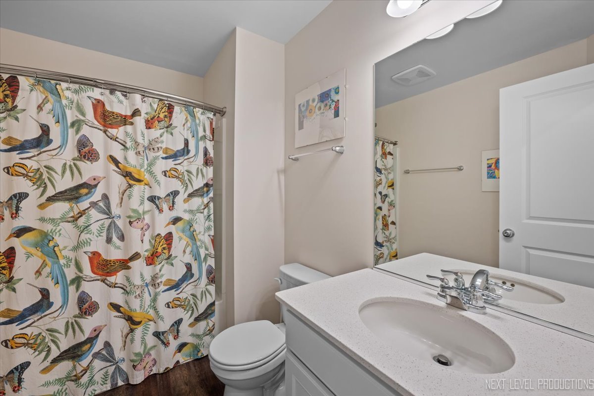 1255 Josiah Road Naperville, IL 60563 - Photo 23 of 39 a bathroom with a sink and a mirror