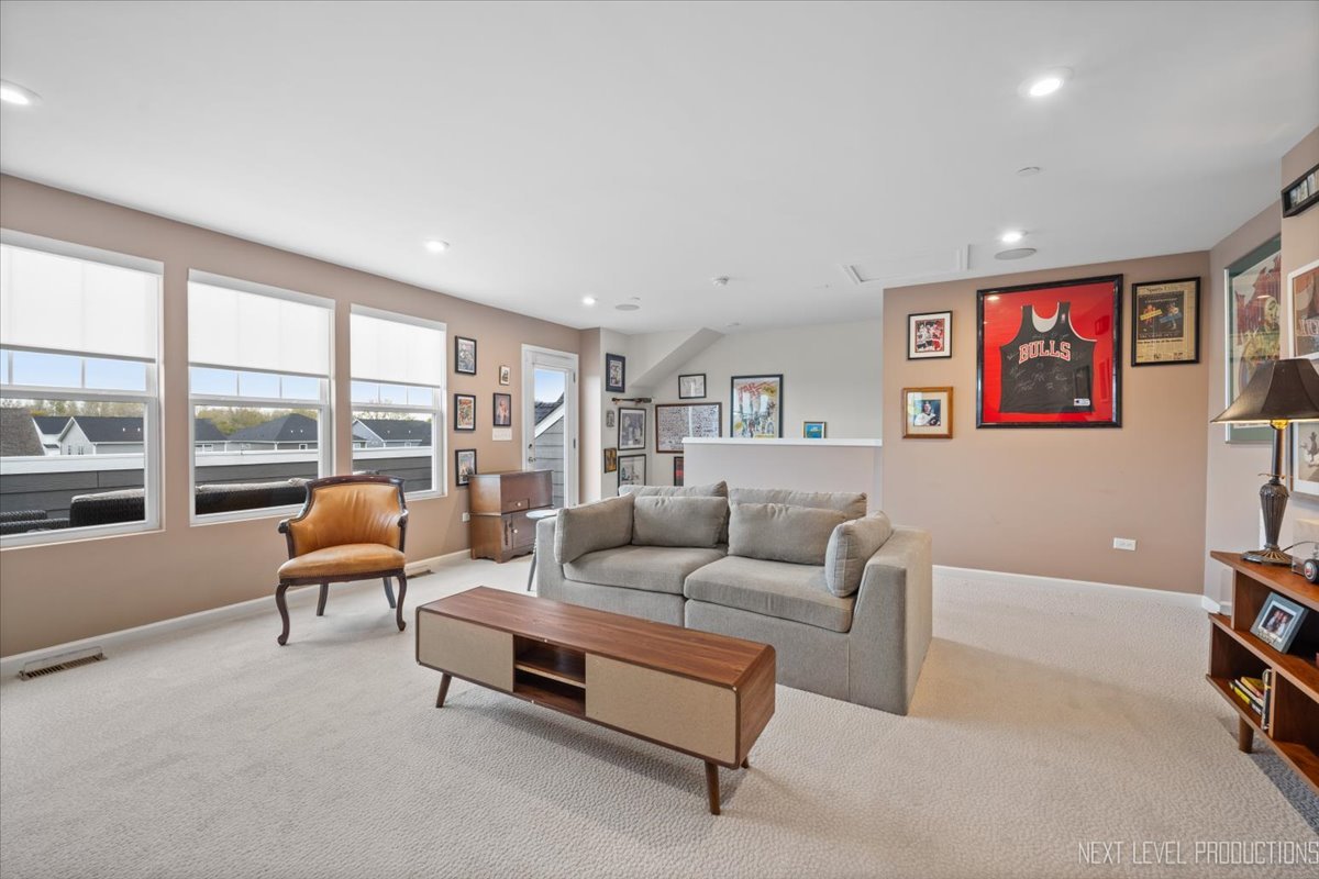 1255 Josiah Road Naperville, IL 60563 - Photo 29 of 39 a living room with furniture and a large window