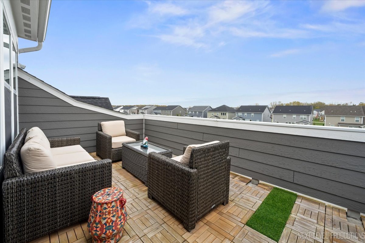 1255 Josiah Road Naperville, IL 60563 - Photo 30 of 39 a balcony with furniture and a rug