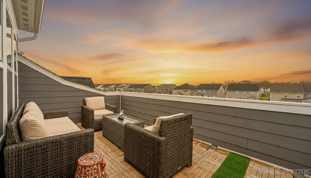 1255 Josiah Road Naperville, IL 60563 - Photo 33 of 39 a view of a roof deck with couches and sky view