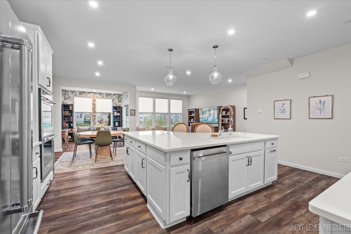 1255 Josiah Road Naperville, IL 60563 - Photo 5 of 39 a kitchen with a sink and wooden floor