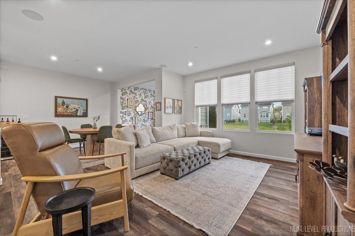 1255 Josiah Road Naperville, IL 60563 - Photo 9 of 39 a living room with furniture and a flat screen tv