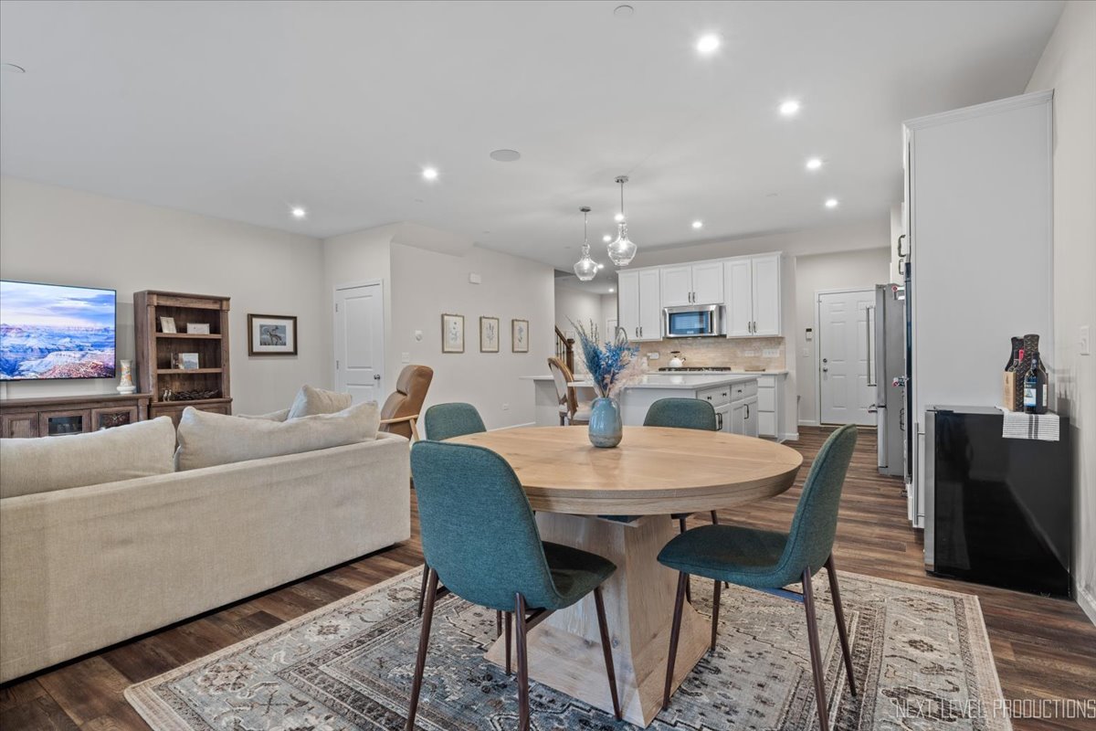 1255 Josiah Road Naperville, IL 60563 - Photo 10 of 39 a living room with furniture a dining table and kitchen view