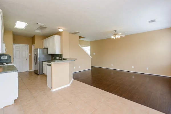 a view of kitchen with cabinets and wooden floor