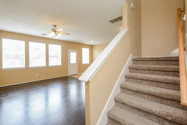 a view of entryway and hall with wooden floor