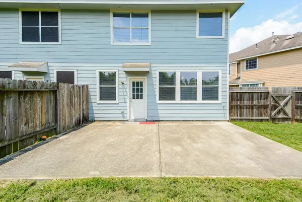 a house with wooden fence