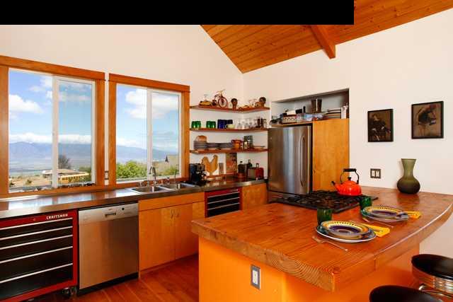 429 Omaopio Road Kula, HI 96790 - Photo 9 of 27 a kitchen with a sink and a stove top oven