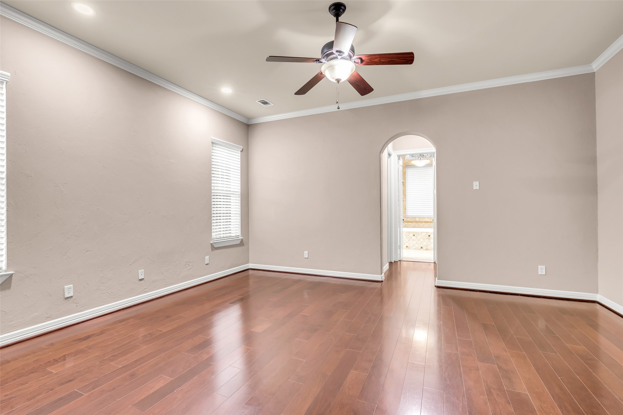 27434 Whispering Maple Way Spring, TX 77386 - Photo 22 of 41 Primary suite has beautiful hardwood floors ad en suite executive primary bath.