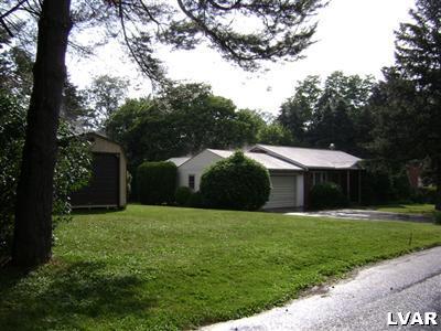 Side of house showing the 1 car detached garage and 2 car attached garage, you will note the nice landscape.