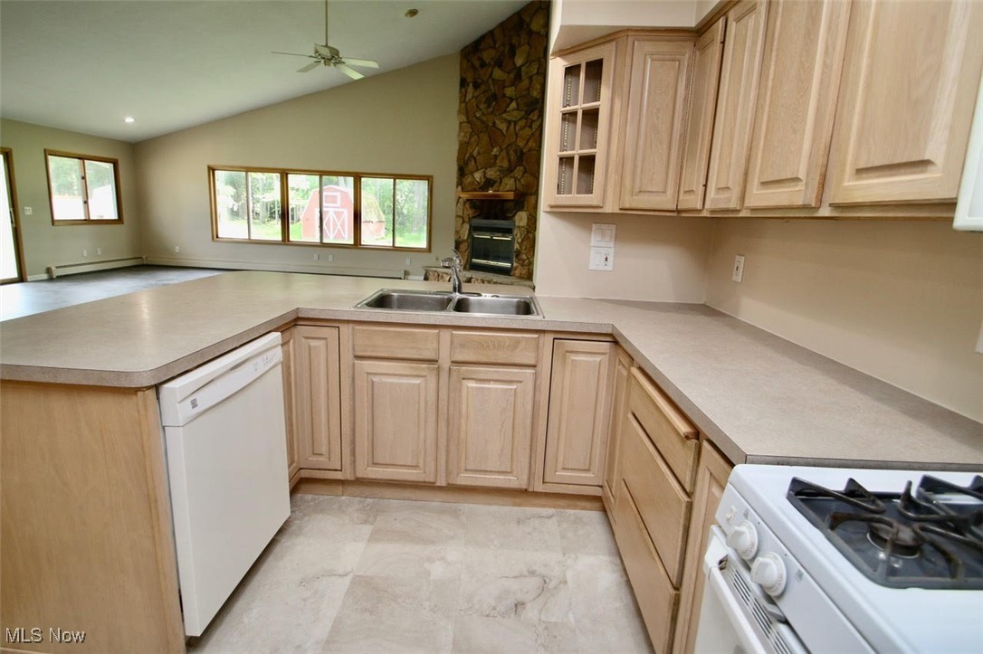 7958 Bellflower Road Mentor, OH 44060 - Photo 12 of 34 Kitchen featuring dishwasher, light brown cabinetry, a peninsula, a baseboard radiator, and a ceiling fan