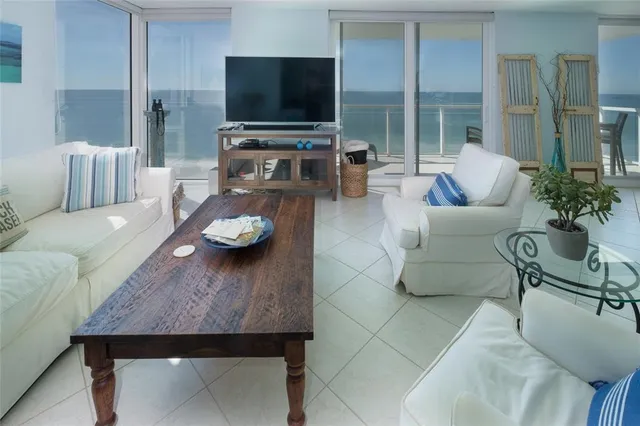 a living room with furniture and a table