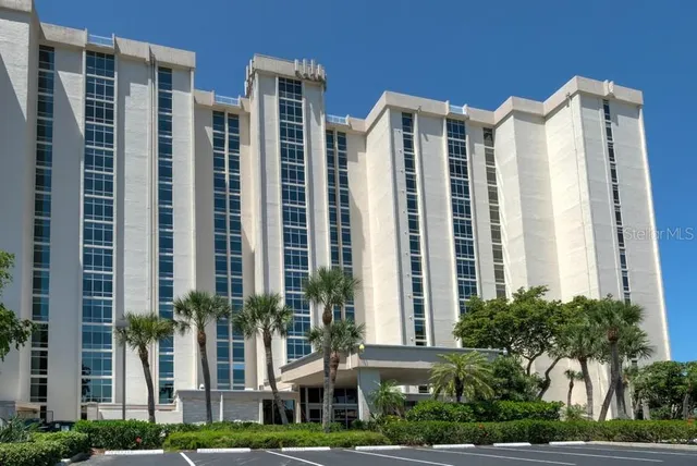 a view of a backyard with sitting area