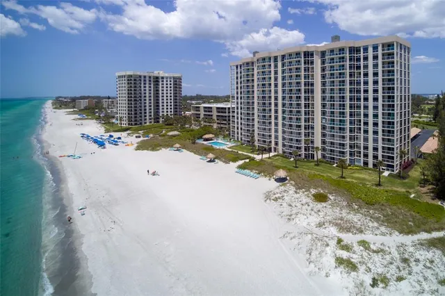 a street sign in front of flowers