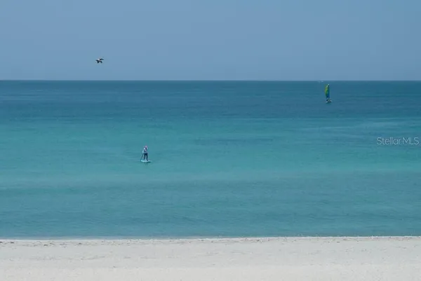 a view of a lake with a yard
