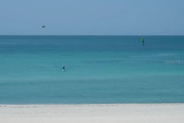 a view of a lake with a yard