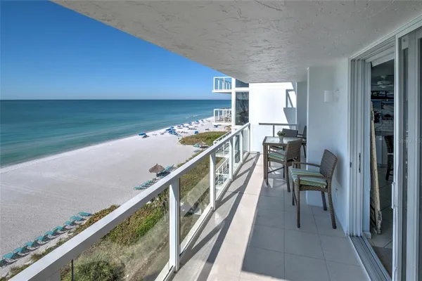 a bedroom with a bed and a lamp on table